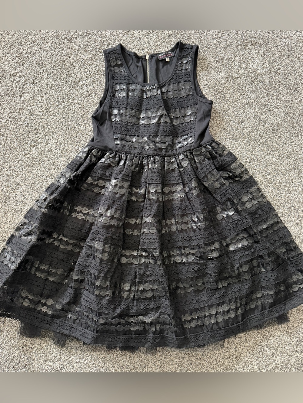 Black lace dress with rows of faux leather textured appliqués - size 14